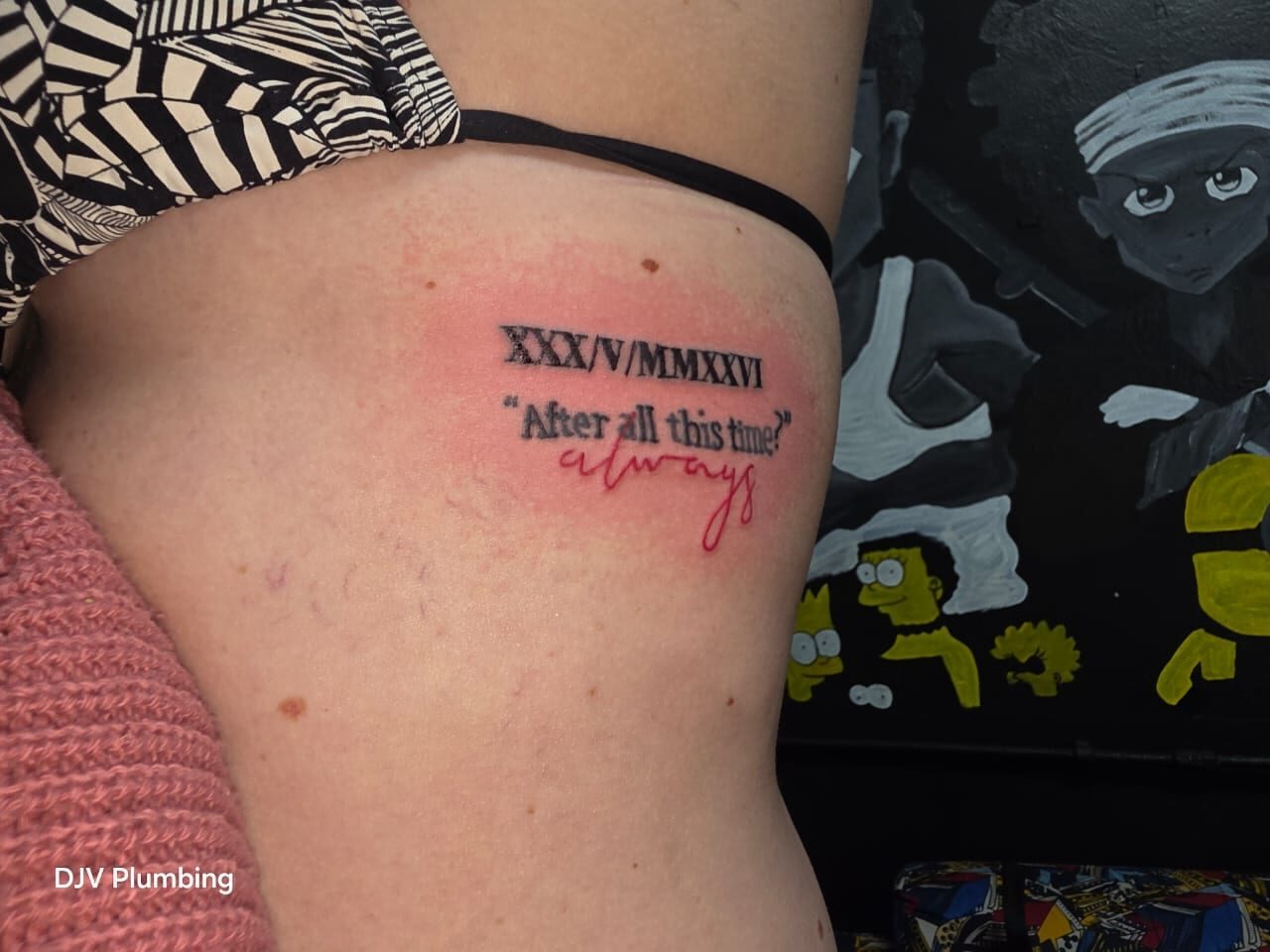Hundreds of tattoos on the wall, one artist behind all of